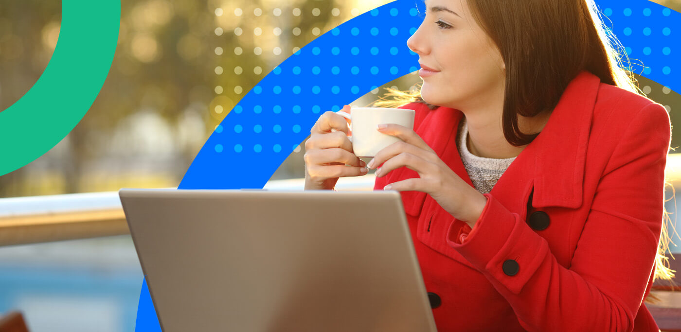 Loyal customer on laptop drinking coffee