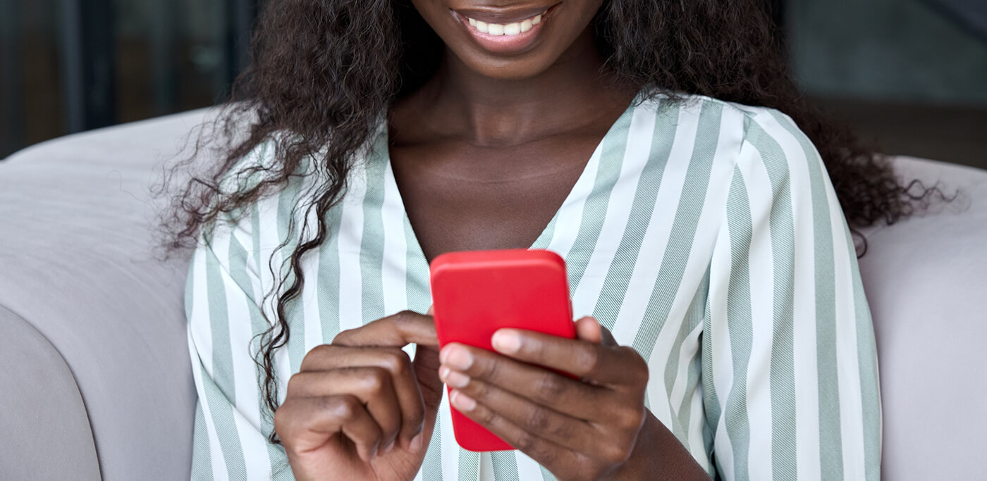 Happy women on a red mobile phone