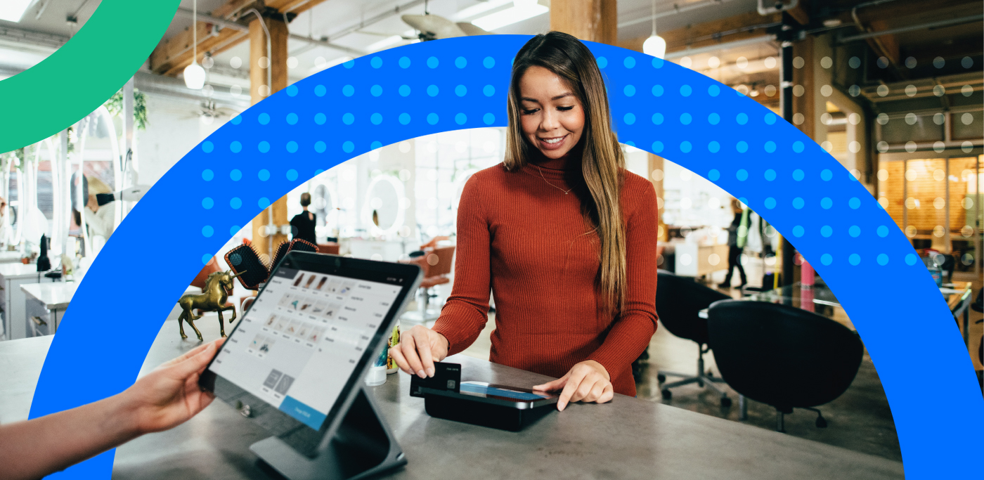 Women in shop paying by card