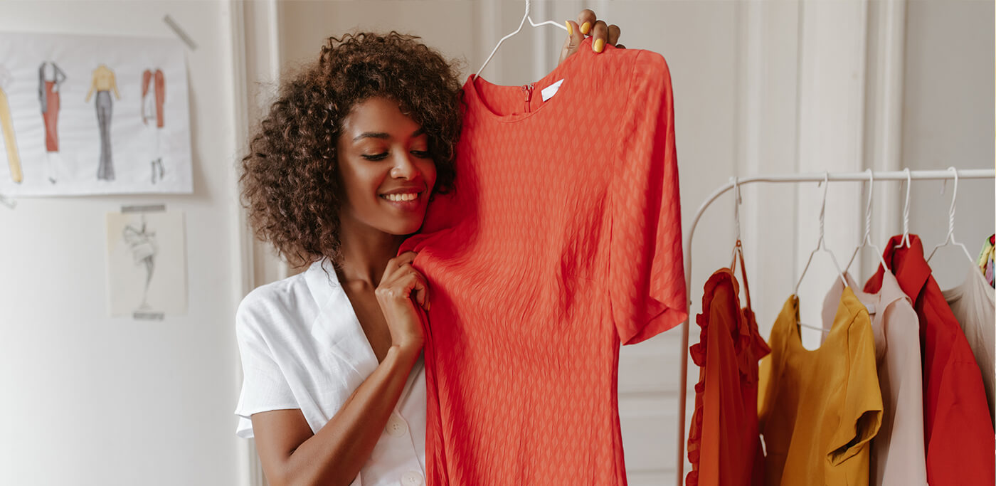 Women looking at summer dresses in wardrobe