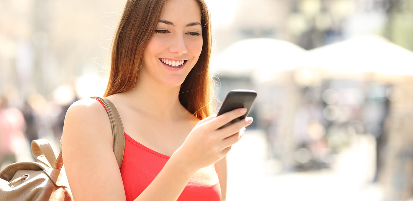 Women on phone wearing red in summer