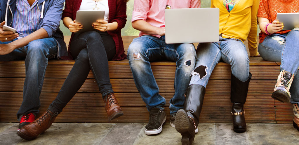 People browsing various tech devices