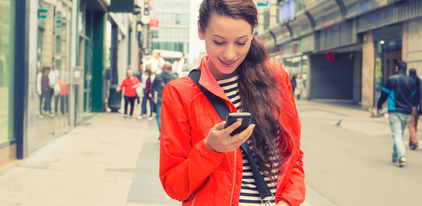 women in street on phone