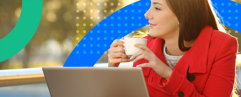 Loyal customer on laptop drinking coffee