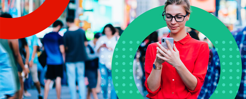 Women walking down the street on mobile