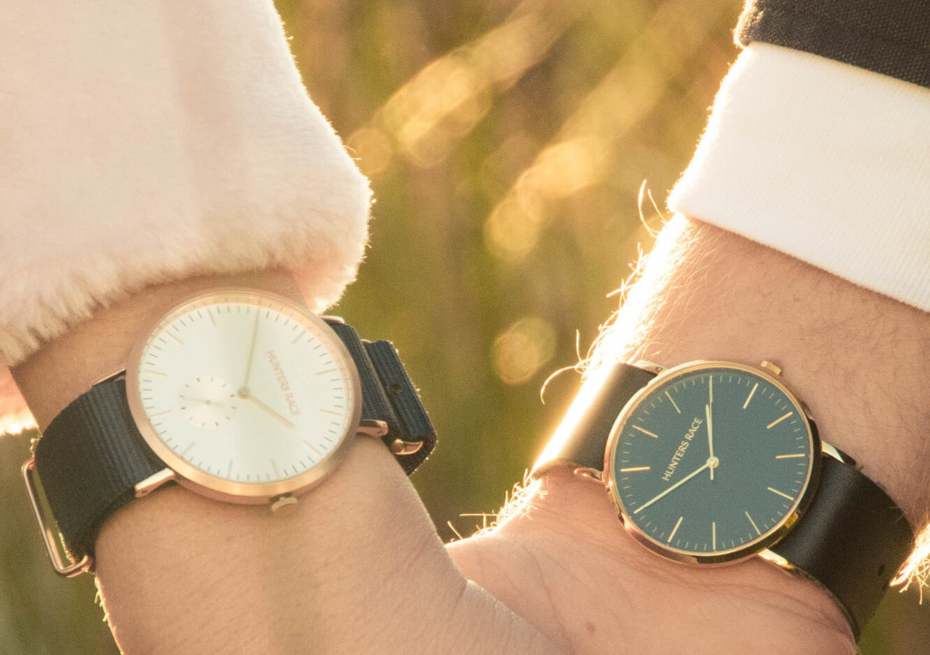 Couple holding hands wearing watches